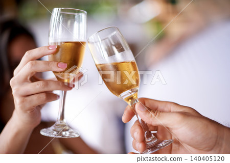 Hands, couple and glass with champagne to toast, celebrate and anniversary with date for bonding. Closeup, relationship and cheers for love with bubbles for romance on vacation, support and care. 140405120