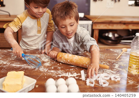 Children, baking and playing in kitchen with ingredients for dessert cake, cookies and fun. Cooking, mess and young brother siblings bonding together for happiness, utensils and smile in house. Children, baking and playing in kitchen with ingredients for dessert cake, cookies and fun. Cooking, mess and young brother siblings bonding together for happiness, utensils and smile in house. 140405259