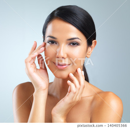 Portrait, woman or hand for skincare, hydration and dermatology in studio on light grey background. Female person, healthy and smile with glow for treatment, facial and self care for flawless skin Portrait, woman or hand for skincare, hydration and dermatology in studio on light grey background. Female person, healthy and smile with glow for treatment, facial and self care for flawless skin 140405366