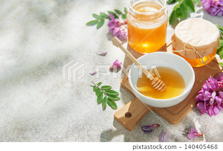 Natural honey in bowls and jars with robinia flowers 140405468