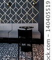 Modern cafe interior design with geometric wallpaper and tiled floor. 140405519