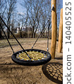 Modern nest swing on outdoor kids playground in park. 140405525