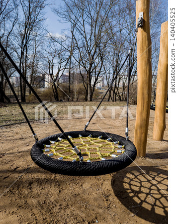 Modern nest swing on outdoor kids playground in park. 140405525