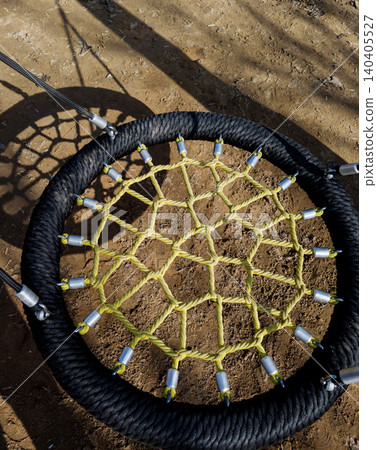 Close-up top view of round rope nest swing structure. Close-up top view of round rope nest swing structure. 140405527