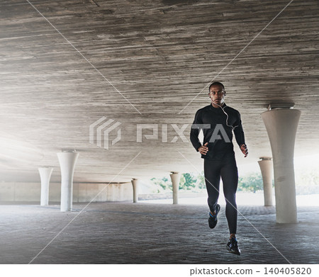 Man, portrait and running for fitness outdoor with music, listening to podcast and exercise for healthy body. Athlete, african person and earphones with audio, radio and sound for workout or training 140405820