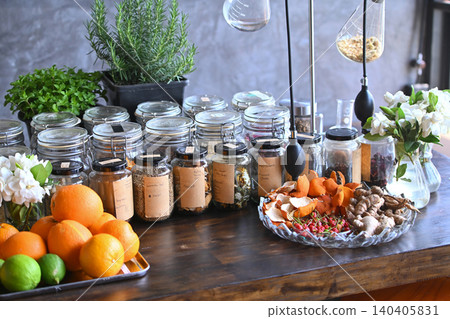 Artisan Apothecary Table with Herbs, Spices, Citrus, and Laboratory Glassware for Botanical Blending Artisan Apothecary Table with Herbs, Spices, Citrus, and Laboratory Glassware for Botanical Blending 140405831