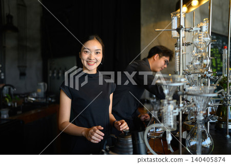 Smiling Asian Female Barista at Specialty Coffee Bar with Siphon Brewing Equipment Smiling Asian Female Barista at Specialty Coffee Bar with Siphon Brewing Equipment 140405874