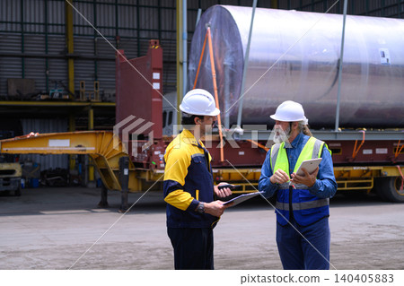 Industrial logistics supervisors discussing cargo shipment operations at freight warehouse Industrial logistics supervisors discussing cargo shipment operations at freight warehouse 140405883