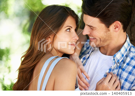 Love, relax and date with couple in park for romance, bonding and summer vacation. Happiness, commitment and smile with young man and woman hugging in nature for funny, support and relationship Love, relax and date with couple in park for romance, bonding and summer vacation. Happiness, commitment and smile with young man and woman hugging in nature for funny, support and relationship 140405913