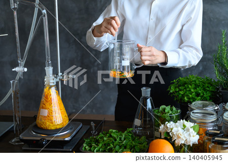 Herbalist Scientist Extracting Natural Plant Essence in Laboratory with Botanical Ingredients and Glassware Herbalist Scientist Extracting Natural Plant Essence in Laboratory with Botanical Ingredients and Glassware 140405945
