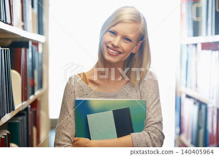 Woman, library and book, portrait with story for education and knowledge with smile on campus. Student, bookstore and reading material for learning, happy with university and academic development 140405964