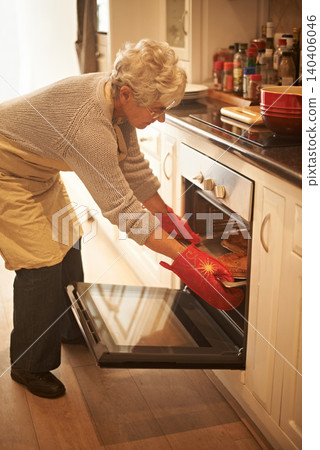 Senior woman, oven and cooking pie at home in kitchen for food, nutrition and dessert. Female person, elderly lady or retired baking pastry dish on tray, pan or stove for eating, dining and enjoyment Senior woman, oven and cooking pie at home in kitchen for food, nutrition and dessert. Female person, elderly lady or retired baking pastry dish on tray, pan or stove for eating, dining and enjoyment 140406046