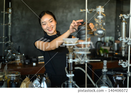 Smiling Asian Female Barista Using Siphon Coffee Brewing Equipment in Specialty Cafe Smiling Asian Female Barista Using Siphon Coffee Brewing Equipment in Specialty Cafe 140406072