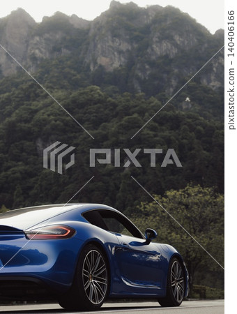 The rugged Mt. Myogi and a blue Porsche The rugged Mt. Myogi and a blue Porsche 140406166