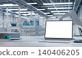 Modern industrial engineering desk with blank laptop screen inside automated smart factory facility 140406205