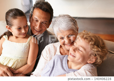 Hug, grandparents and grandchildren with smile for family, photo and multi generation bonding. Senior couple, boy and girl with laugh, love and happiness for playful relationship together at home Hug, grandparents and grandchildren with smile for family, photo and multi generation bonding. Senior couple, boy and girl with laugh, love and happiness for playful relationship together at home 140406228