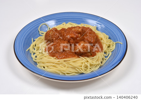 Spaghetti and meatballs with tomato sauce on a blue plate 140406240