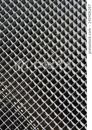 Industrial metal drainage grate with a square grid pattern Industrial metal drainage grate with a square grid pattern 140406267