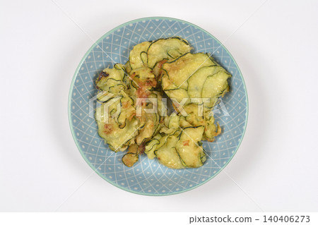 Top down view of fried zucchini fritters on a plate Top down view of fried zucchini fritters on a plate 140406273