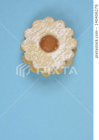 Linzer cookie with jam on blue background Linzer cookie with jam on blue background 140406279