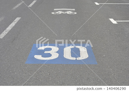 Speed limit 30 sign painted on asphalt road surface Speed limit 30 sign painted on asphalt road surface 140406290