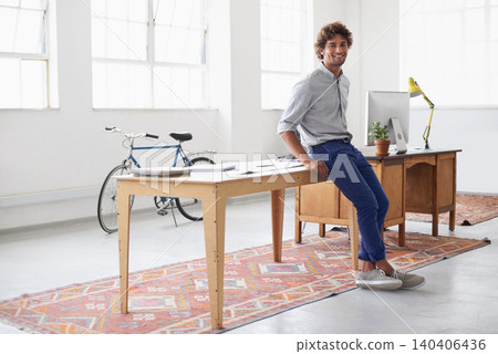 Man, portrait and morning in office with ideas for interior design, renovation and startup for project. Male person, inspiration and creativity for small business, computer and confident for work 140406436