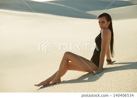 Portrait, desert or woman with bikini, dune or weekend break with sand, travel or getaway trip. Sunshine, person or girl with holiday or summer with vacation or outdoor with tropical island or relax Portrait, desert or woman with bikini, dune or weekend break with sand, travel or getaway trip. Sunshine, person or girl with holiday or summer with vacation or outdoor with tropical island or relax 140406534