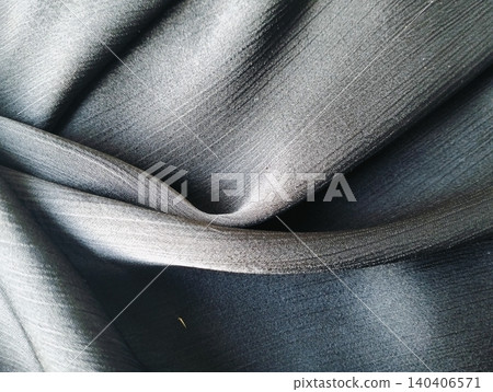 Elegant black satin silk fabric texture background for luxury concept product placement Elegant black satin silk fabric texture background for luxury concept product placement 140406571