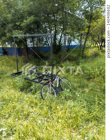 Abandoned bicycles in overgrown urban green space Abandoned bicycles in overgrown urban green space 140406682