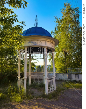 Charming vintage gazebo in a sunlit forested garden setting Charming vintage gazebo in a sunlit forested garden setting 140406694