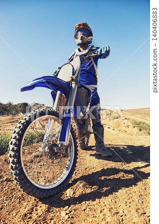 Motorcycle, sports and danger with biker person outdoor, low angle with uniform for riding on dirt track. Speed, power and risk with motorbike, transportation and adventure for adrenaline and travel Motorcycle, sports and danger with biker person outdoor, low angle with uniform for riding on dirt track. Speed, power and risk with motorbike, transportation and adventure for adrenaline and travel 140406883