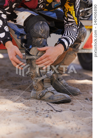 Hands, boots and motorbike with person getting ready for competition, race or training closeup. Exercise, fitness and sports with athlete outdoor in preparation of off road action or performance Hands, boots and motorbike with person getting ready for competition, race or training closeup. Exercise, fitness and sports with athlete outdoor in preparation of off road action or performance 140406890