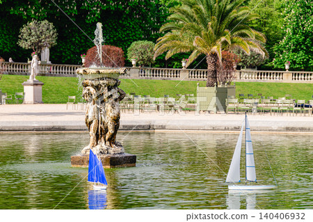 Model sailing boats glide across the pond in the Garden Luxembourg. Model sailing boats glide across the pond in the Garden Luxembourg. 140406932