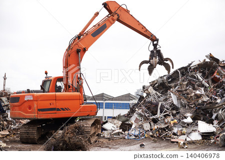 Crane, vehicle and junkyard to recycle metal with sustainability, manufacturing and stop pollution. Machine, tractor and scrapyard for ecology at plant with iron, steel and industry in environment Crane, vehicle and junkyard to recycle metal with sustainability, manufacturing and stop pollution. Machine, tractor and scrapyard for ecology at plant with iron, steel and industry in environment 140406978