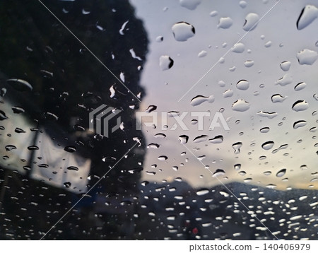 Raindrops on car windshield view from inside vehicle during rainy day trip. Raindrops on car windshield view from inside vehicle during rainy day trip. 140406979