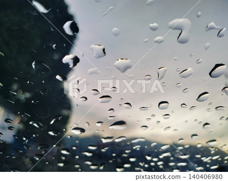 Raindrops on car windshield view from inside vehicle during rainy day trip. Raindrops on car windshield view from inside vehicle during rainy day trip. 140406980