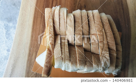 Sliced white bread on a rustic wooden table background Sliced white bread on a rustic wooden table background 140406981