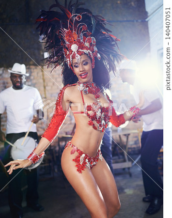 Band, dance and woman at carnival with costume for celebration, music and happy samba performance in Brazil. Culture, party and girl in street festival, parade or show in Rio de Janeiro with smile. Band, dance and woman at carnival with costume for celebration, music and happy samba performance in Brazil. Culture, party and girl in street festival, parade or show in Rio de Janeiro with smile. 140407051