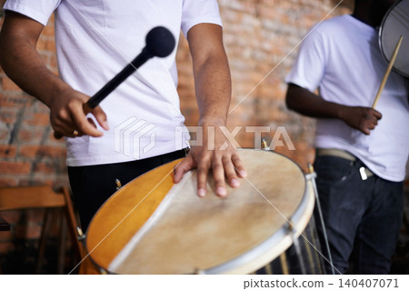 Hands, drum or carnival with a person playing an instrument in a festival in Rio de Janeiro, Brazil. Closeup, band or party with a musician, performer or artist banging to create a beat or rhythm 140407071