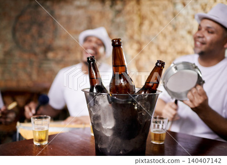 Musician, band and group with drink, men and happy for drums, performance and party with alcohol. Friends, artist and singing with bottle, beer and relax in pub for social event in Rio de Janeiro Musician, band and group with drink, men and happy for drums, performance and party with alcohol. Friends, artist and singing with bottle, beer and relax in pub for social event in Rio de Janeiro 140407142