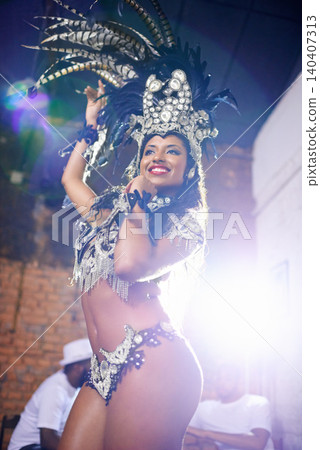 Carnival, dance and woman in costume at night for festival, celebration and holiday party. Street, samba dancer and person in masquerade outfit for performance, culture and event in Rio de Janeiro Carnival, dance and woman in costume at night for festival, celebration and holiday party. Street, samba dancer and person in masquerade outfit for performance, culture and event in Rio de Janeiro 140407313