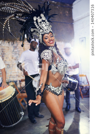 Carnival, dancing and woman in costume for festival, celebration and street party. Samba fashion, dancer and happy person in masquerade outfit for performance, culture and concert in Rio de Janeiro Carnival, dancing and woman in costume for festival, celebration and street party. Samba fashion, dancer and happy person in masquerade outfit for performance, culture and concert in Rio de Janeiro 140407316