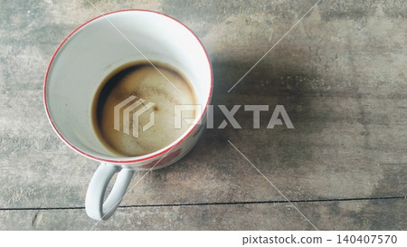 Empty Coffee Cup with Stains and Dregs on Wooden Table 140407570