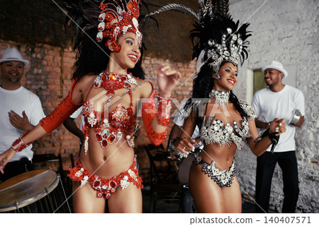 Music, samba and women at carnival in costume for celebration, performance culture and happy band in Brazil. Dance, party and girl friends together at festival, parade or stage show in Rio de Janeiro Music, samba and women at carnival in costume for celebration, performance culture and happy band in Brazil. Dance, party and girl friends together at festival, parade or stage show in Rio de Janeiro 140407571