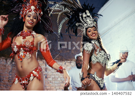Portrait, carnival or women in costume dancing for celebration, music culture or samba in Brazil. Girl friends, night or dancers with rhythm or fashion at festival, parade or show in Rio de Janeiro 140407582
