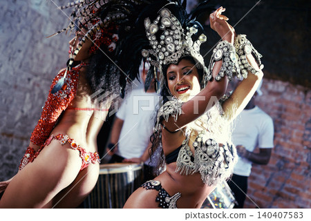 Party, carnival or women in costume dancing for celebration, music culture or samba in Brazil. Girl friends, smile or dancers with rhythm or fashion at festival, parade or fun show in Rio de Janeiro Party, carnival or women in costume dancing for celebration, music culture or samba in Brazil. Girl friends, smile or dancers with rhythm or fashion at festival, parade or fun show in Rio de Janeiro 140407583