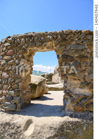 Uplistsikhe cave complex, ancient rock-hewn town and one of the oldest settlements near the town of Gori in Georgia Uplistsikhe cave complex, ancient rock-hewn town and one of the oldest settlements near the town of Gori in Georgia 140407648