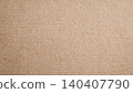 Close-up of natural brown kraft paper texture with subtle fiber details 140407790