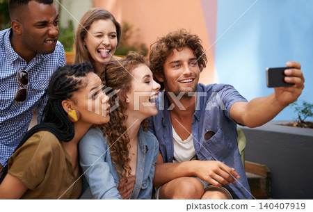 Crazy, face and group of friends for selfie at university campus for profile picture update or social media post. Men, women and happy students with technology for memory, diversity and college fun Crazy, face and group of friends for selfie at university campus for profile picture update or social media post. Men, women and happy students with technology for memory, diversity and college fun 140407919