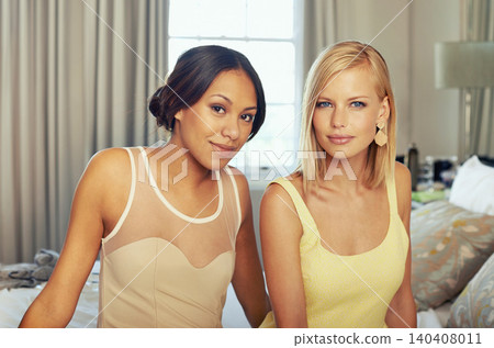Happy women, portrait and elegant dresses in hotel for fashion, confidence and bonding together for gala event. Friends, bedroom and face with style clothes with care and excited for formal party Happy women, portrait and elegant dresses in hotel for fashion, confidence and bonding together for gala event. Friends, bedroom and face with style clothes with care and excited for formal party 140408011